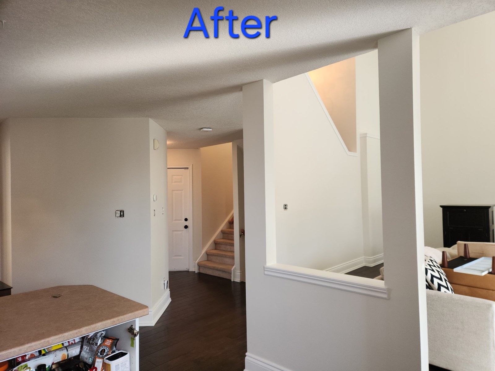 Hallway and adjoining living area after painting was completed