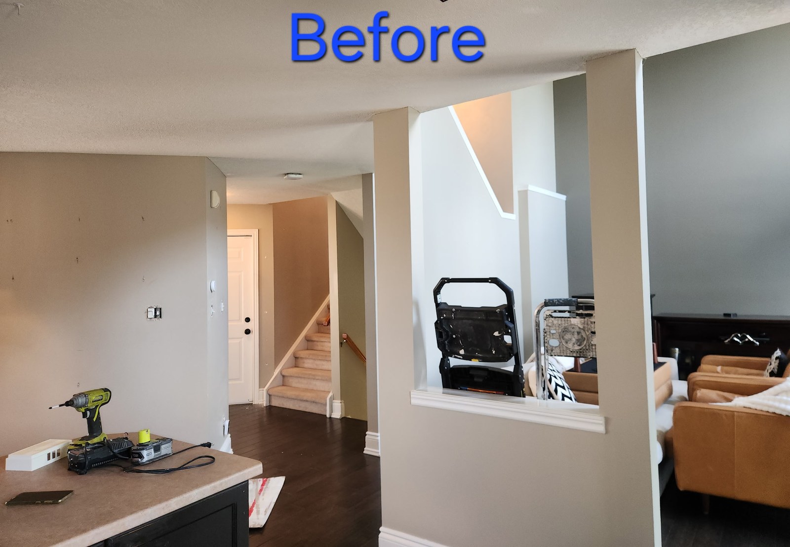 Hallway and adjoining living area before preparation and repainting